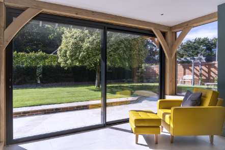 Image of yellow arm chair infront of glass window