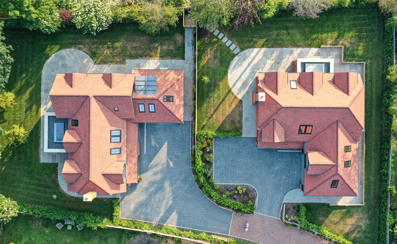 Aerial view of land surrounded by large trees